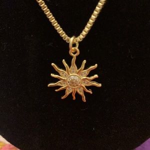 NWOT gold sun and diamond necklace. Stainless Steel.